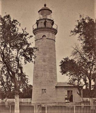 Land Lighthouse with picket fence photo edited